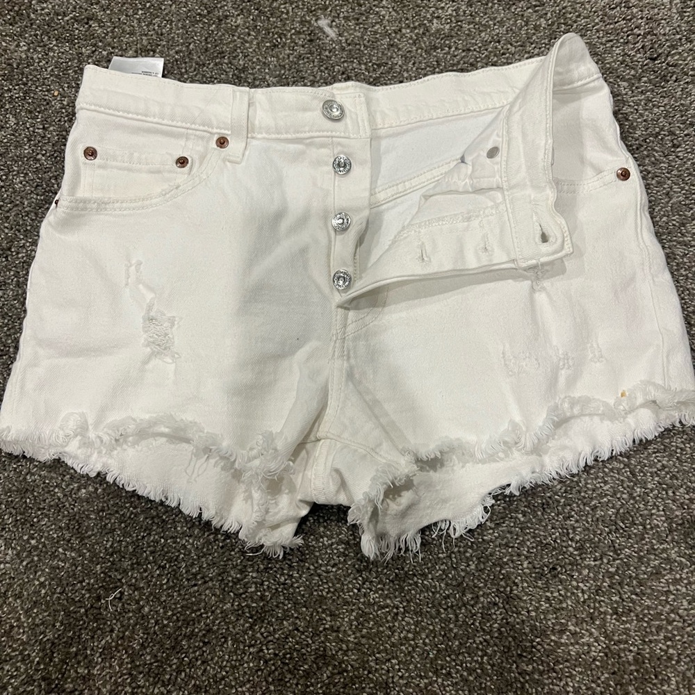 Levi’s 501 white distressed shorts with button fly size 28